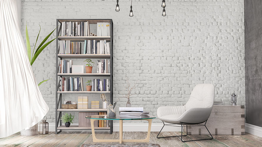 Leseraum mit Sessel, kleinem Tisch und Bücherregal Leseraum mit Sessel, kleinem Tisch und Bücherregal